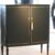 Schrank schwarz mit Blattgold-Linien – antik, um 1930