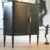 Schrank schwarz mit Blattgold-Linien – antik, um 1930